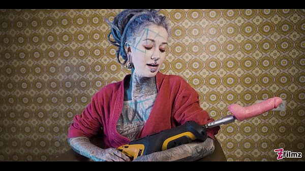 Ink-covered babe gets her ass wrecked by the fuck machine