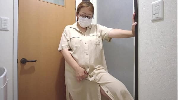 A married woman feels pleasure from standing masturbation